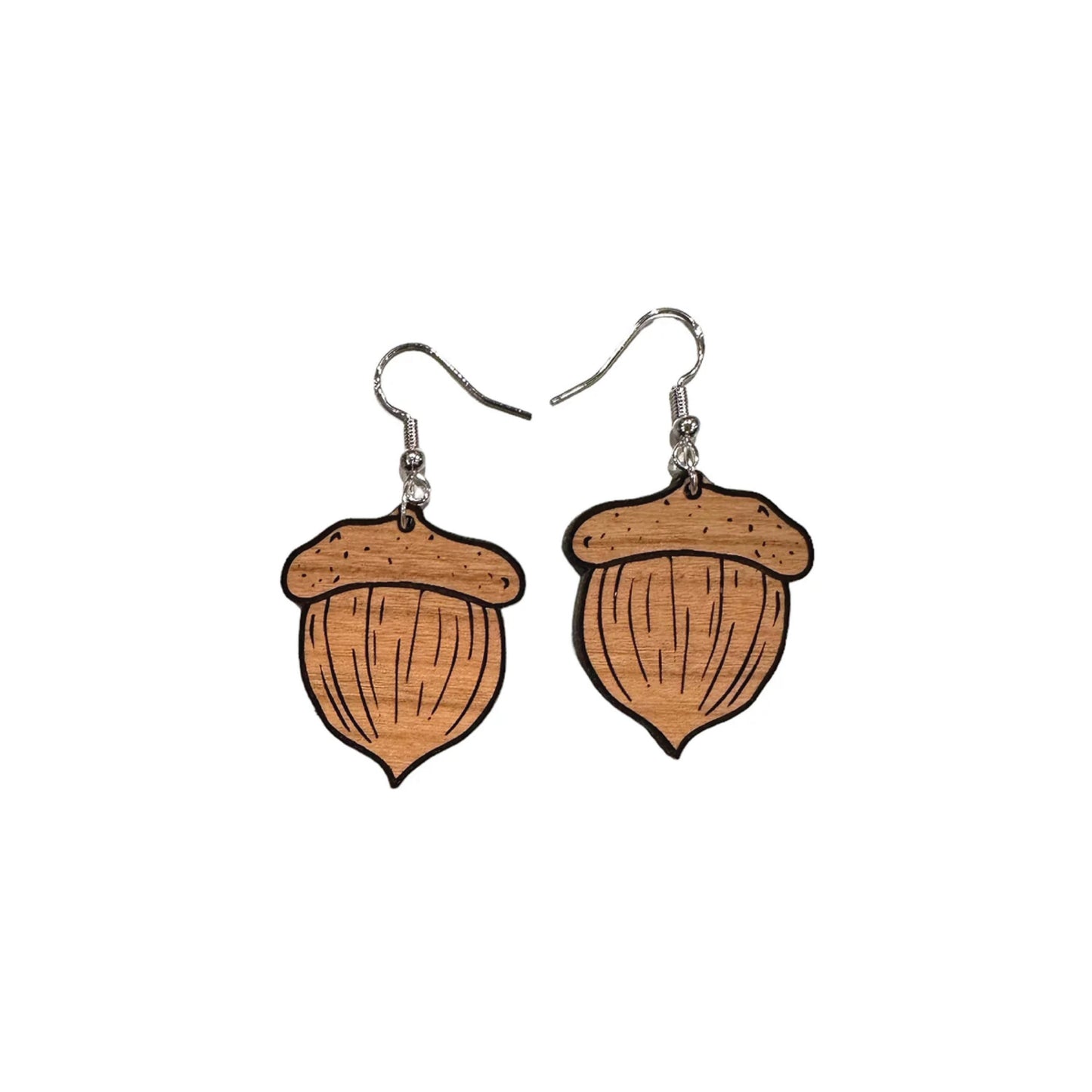 May include: A pair of brown wooden acorn dangle earrings. Each earring features a detailed acorn design with visible wood grain texture and black outlines. The earrings hang from silver-toned hooks. These nature-inspired earrings are perfect for adding a touch of autumn charm to any outfit.