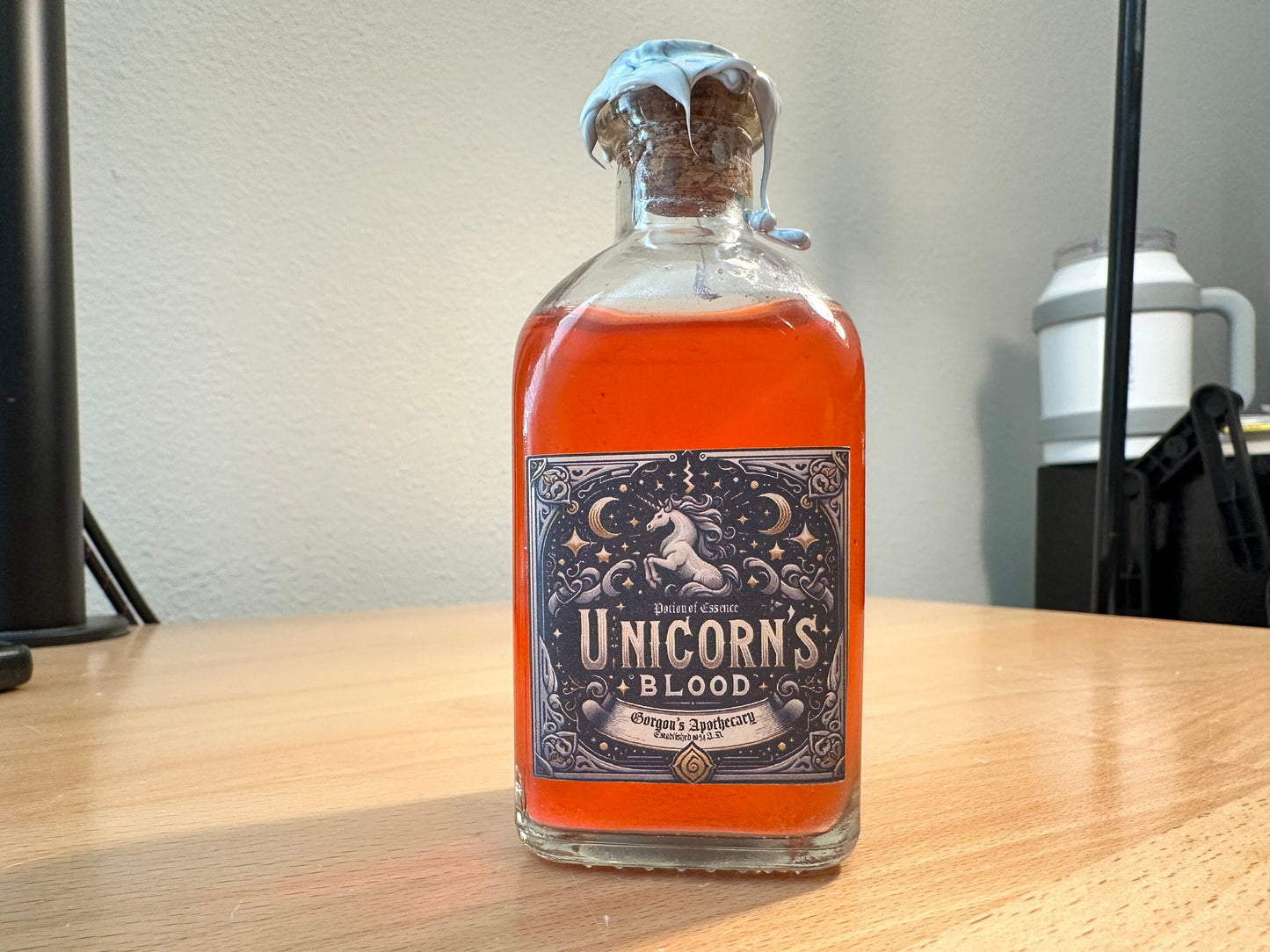 Unicorn Blood: A Potion of Essence - Enigmatic Silver-Red Swirling Decor Vial by Gorgon's Apothecary
