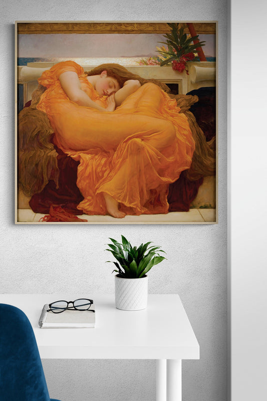 May include: A framed painting of a woman in a flowing orange robe sleeping on a couch. The woman&#39;s hair is long and brown. The background is a light blue sky with a view of the ocean.