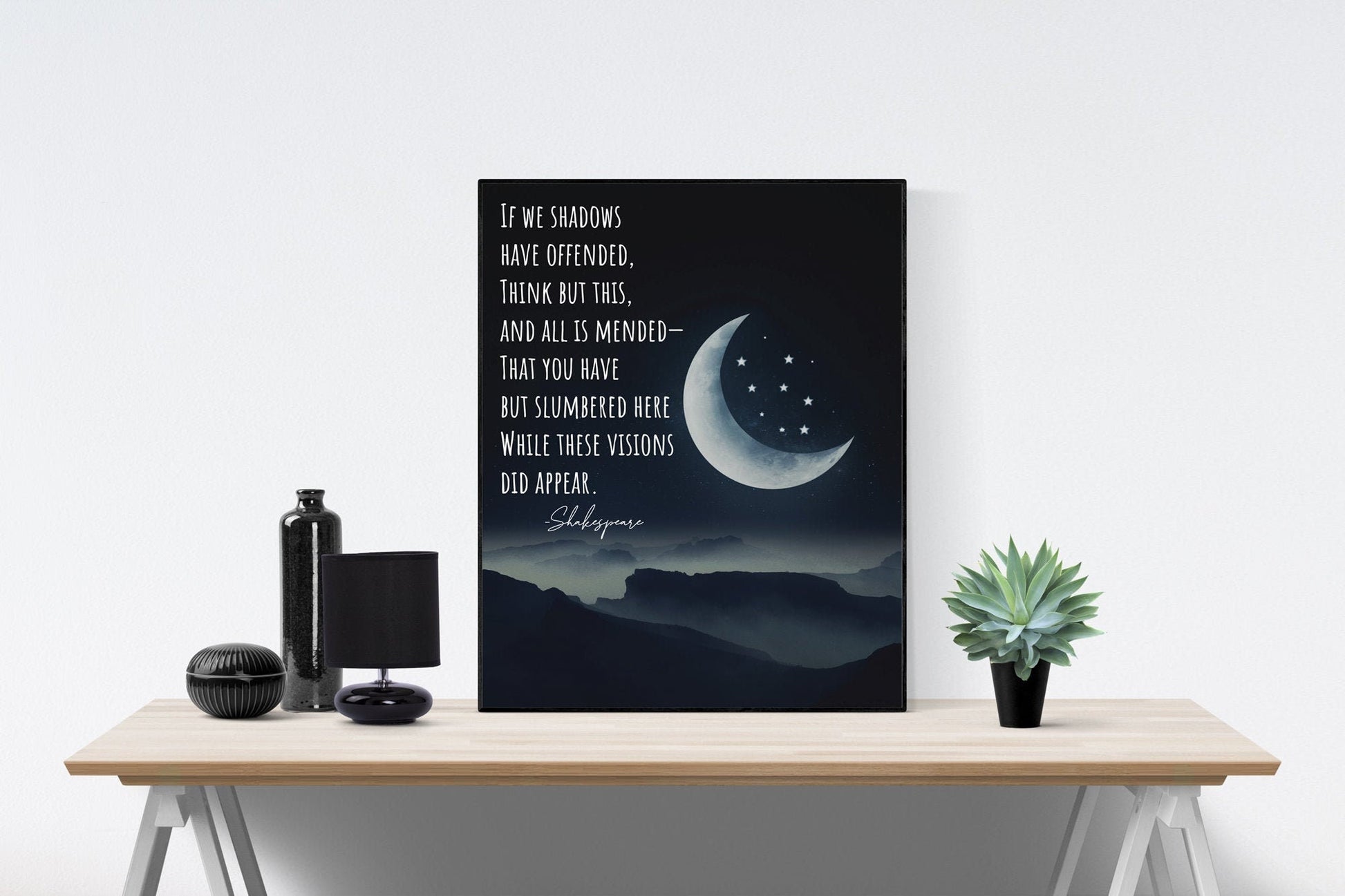 May include: A black and white poster with a quote from Shakespeare that reads &#39;If we shadows have offended, think but this, and all is mended- That you have but slumbered here while these visions did appear.&#39; The poster features a crescent moon with stars in the night sky and a mountain range in the background.