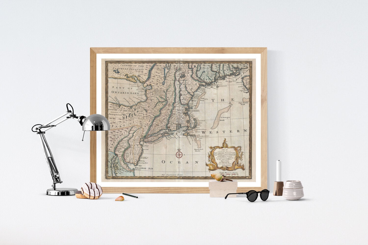 May include: A framed antique map of the eastern coast of North America. The map is printed in brown, black, and blue ink on a cream-colored background. The map shows the coastline from the Great Lakes to the Gulf of Mexico, with the text &#39;THE WESTERN OCEAN&#39; printed in the lower right corner.
