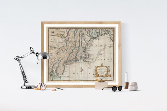 May include: A framed antique map of the eastern coast of North America. The map is printed in brown, black, and blue ink on a cream-colored background. The map shows the coastline from the Great Lakes to the Gulf of Mexico, with the text &#39;THE WESTERN OCEAN&#39; printed in the lower right corner.