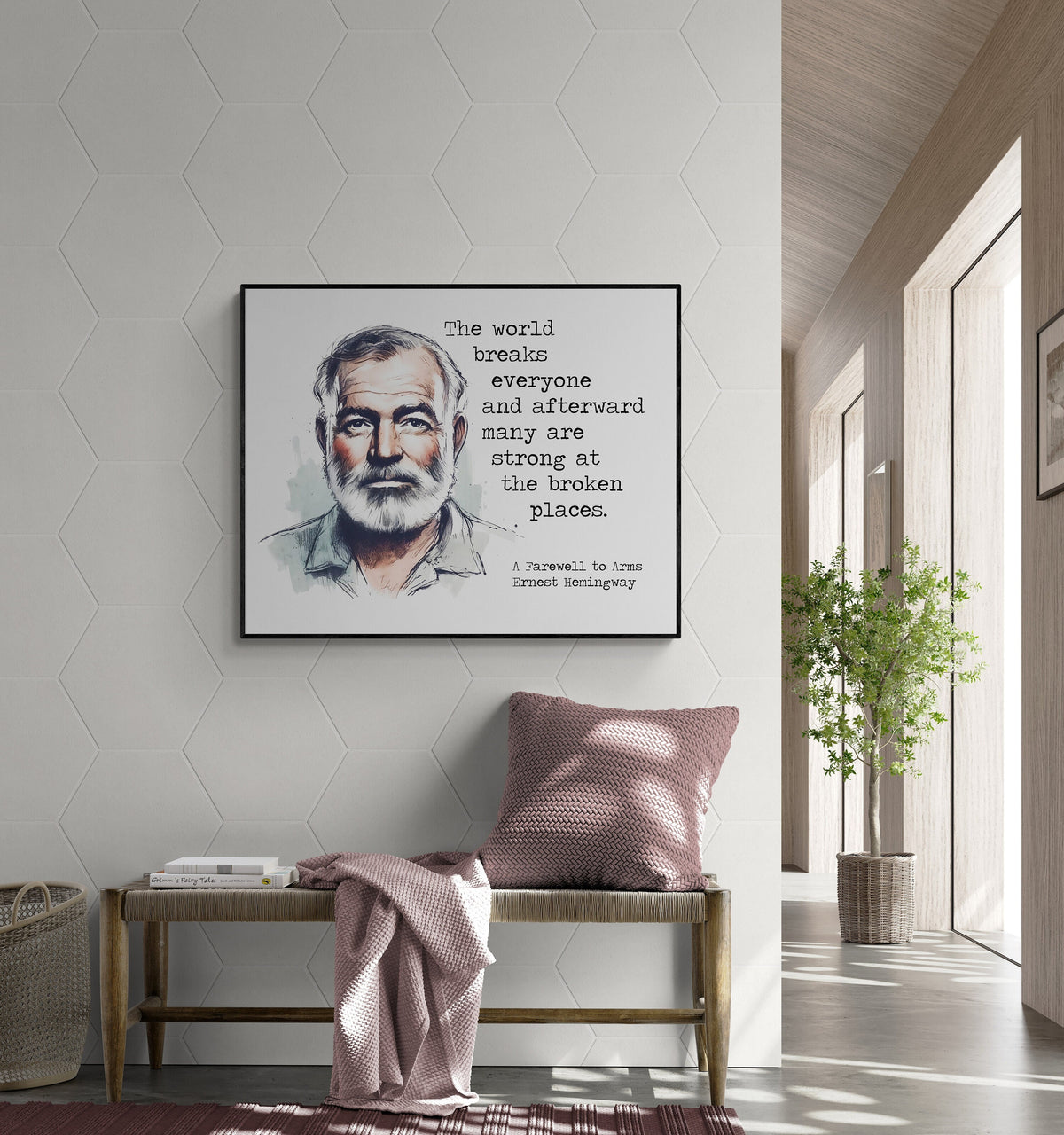 May include: A black framed canvas print with a watercolor illustration of Ernest Hemingway. The quote 'The world breaks everyone and afterward many are strong at the broken places.' is printed below the illustration. The quote is attributed to Ernest Hemingway and the book 'A Farewell to Arms'. The print is hanging on a white wall with hexagonal tiles.