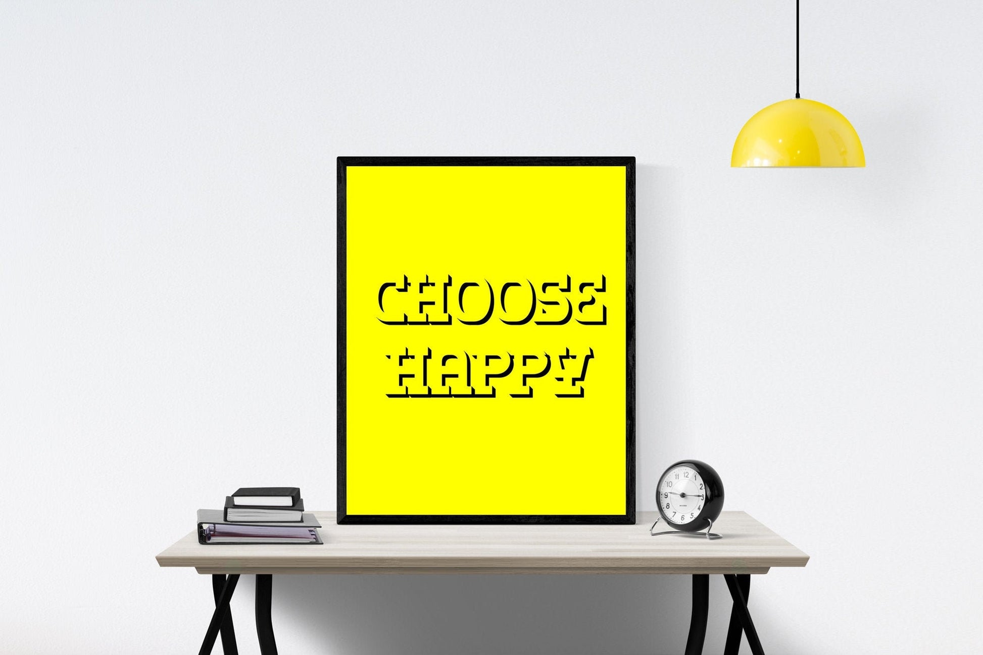 May include: A black framed picture with a yellow background and the text 'CHOOSE HAPPY' in black outlined letters.