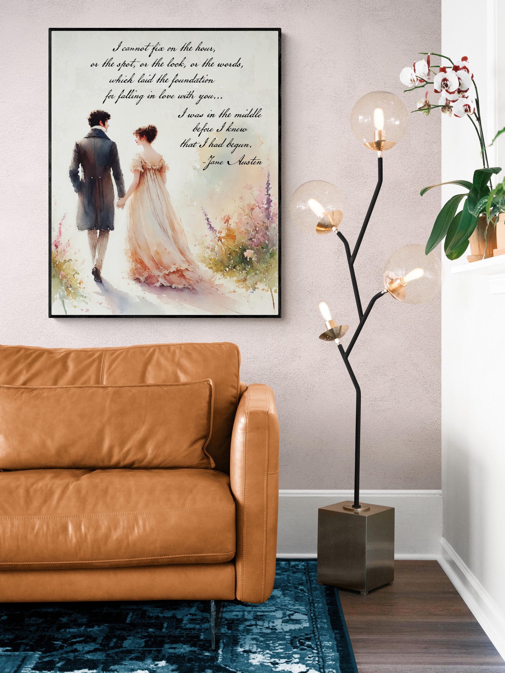 May include: A watercolor painting of a couple walking in a garden. The painting is framed and hanging on a wall. The text in the painting reads: 'I cannot fix on the hour, or the spot, or the look, or the words, which laid the foundation for falling in love with you.... I was in the middle before I knew that I had begun. Jane Austen'.