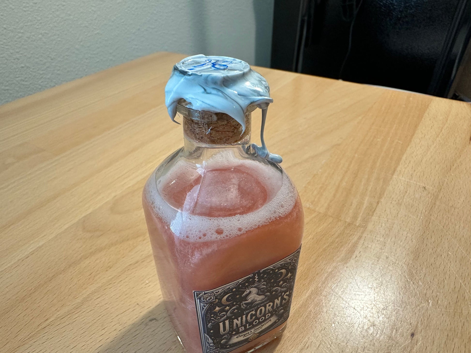 Unicorn Blood: A Potion of Essence - Enigmatic Silver-Red Swirling Decor Vial by Gorgon's Apothecary